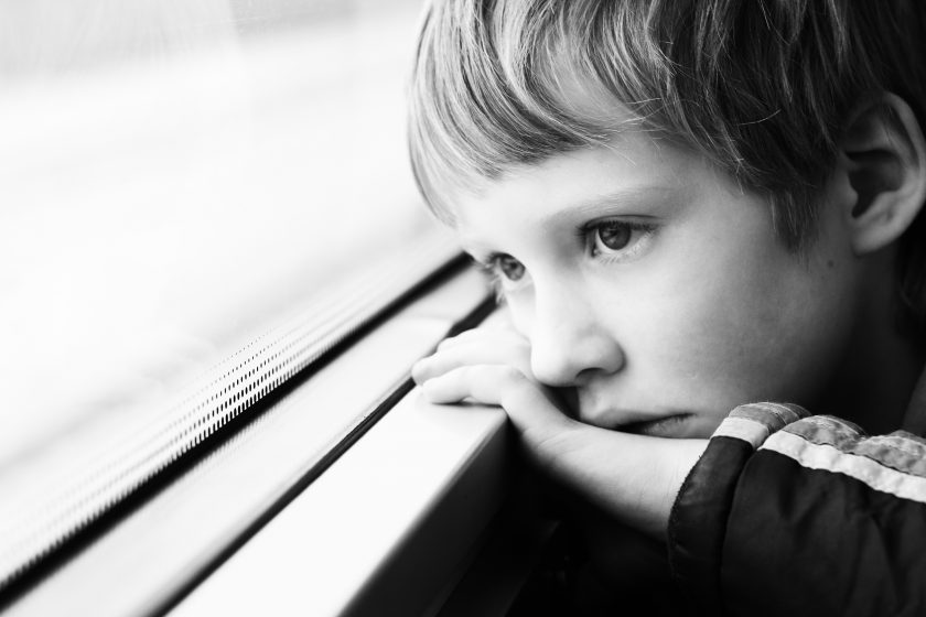 Boy looking through the window